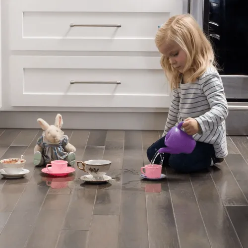 Kid playing with toys | Flooring By Design