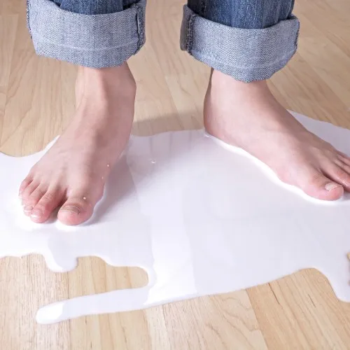 Spilled milk & feet on floor | Flooring By Design